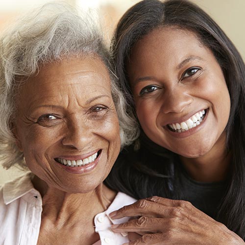 mother daughter hugging smiling